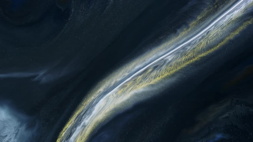 Ribbons of white and gold flow down a black slope