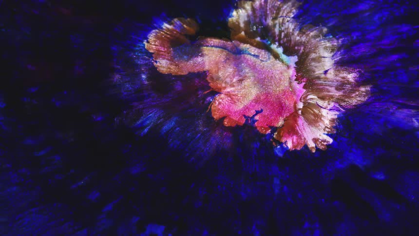 Different colors of liquid flow together