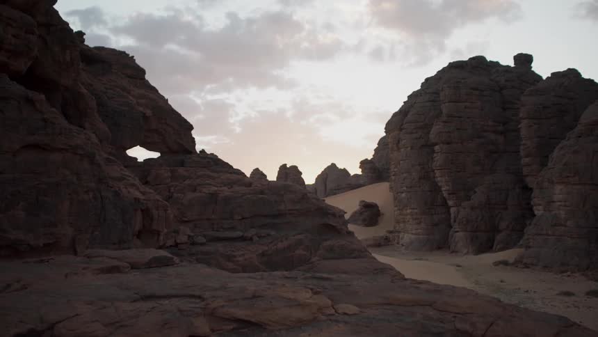 Rock formations cover the ground in the desert