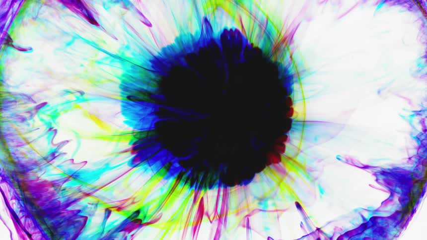 Multi-colored drops of ink create a pattern of an iris