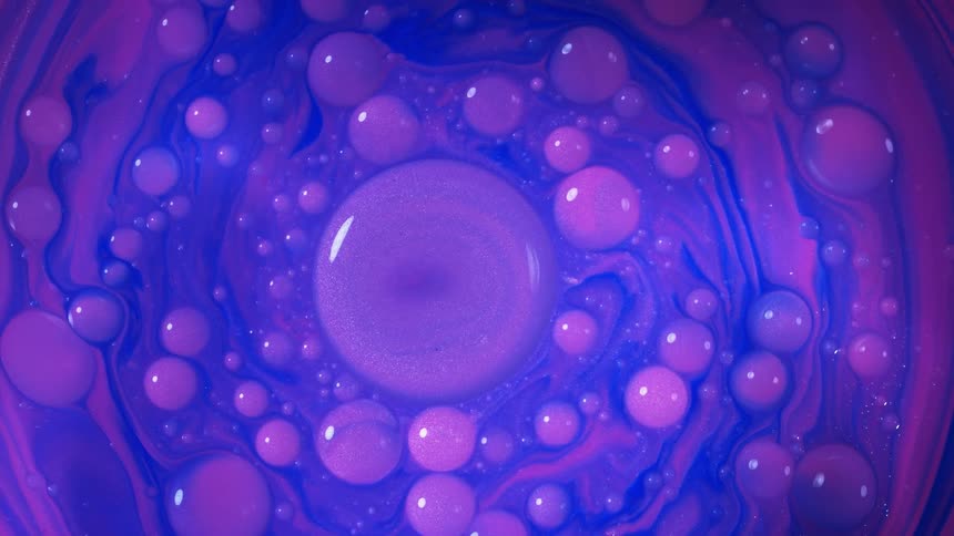 Purple and blue liquid spins in a circle