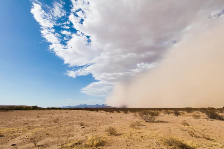 A dust storm rolls over the plains
