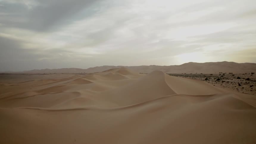 Dunes and formations stand in the desert