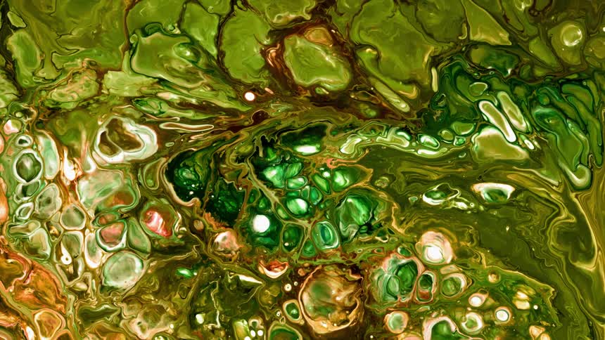 Paint is bubbling and flowing around in an abstract pattern
