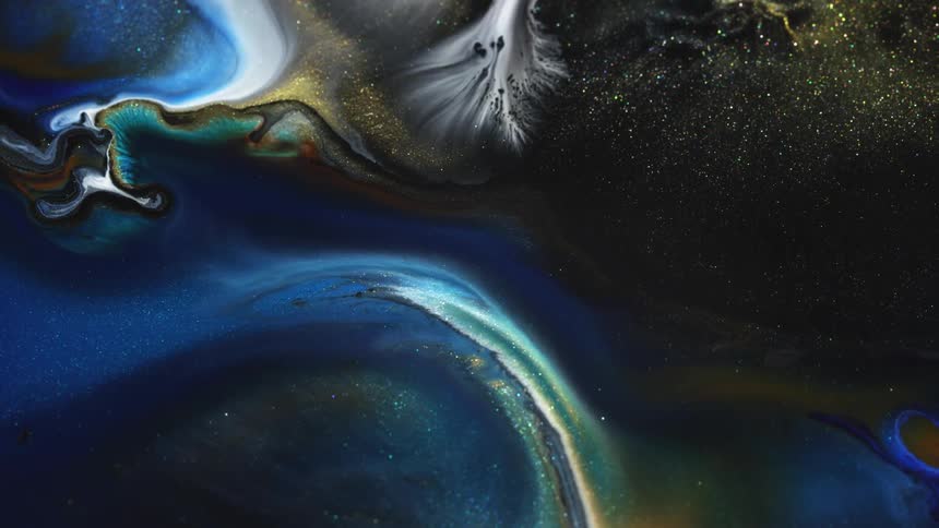 Glittery paint glistens and flows
