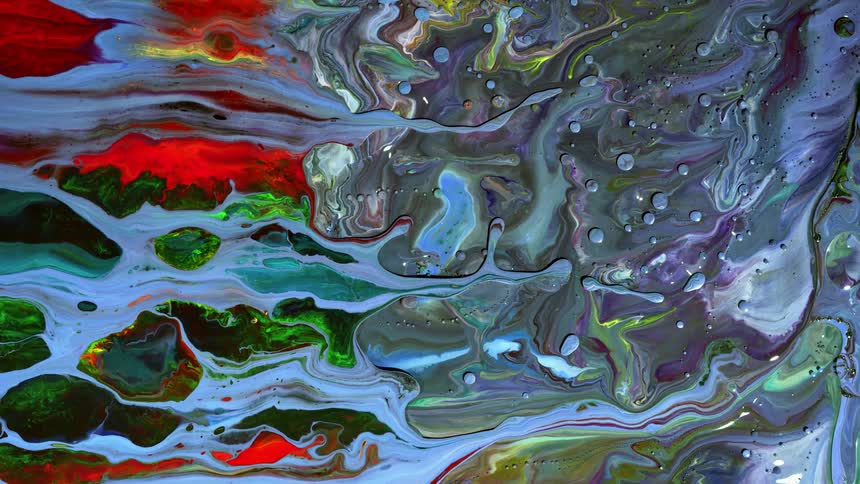 Multi-colored liquid rotates and swirls together