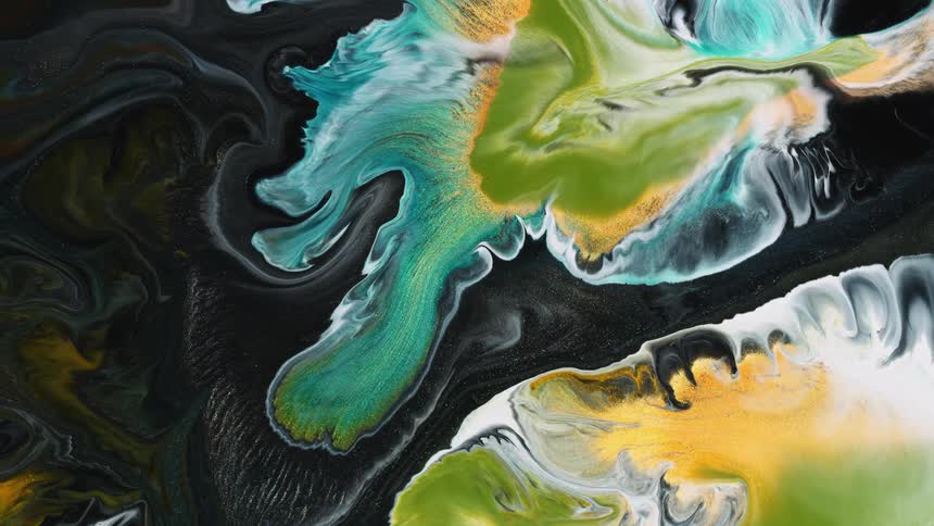 Multi-colored liquid rotates and swirls together