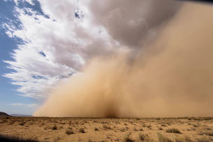 A dust storm moves across the land