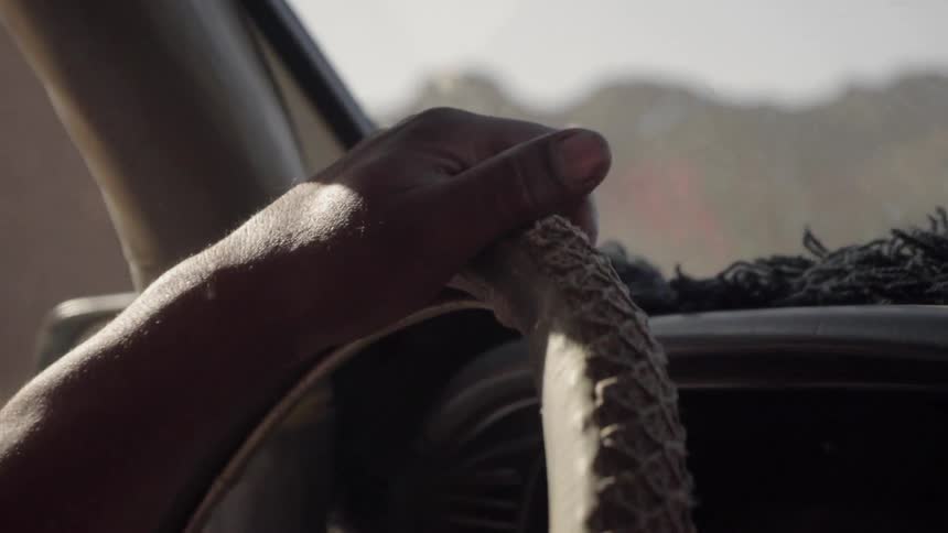 A person drives on a bumpy road