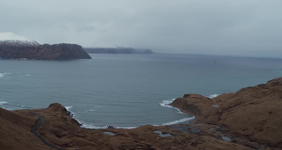 Waves are crashing ashore on an island