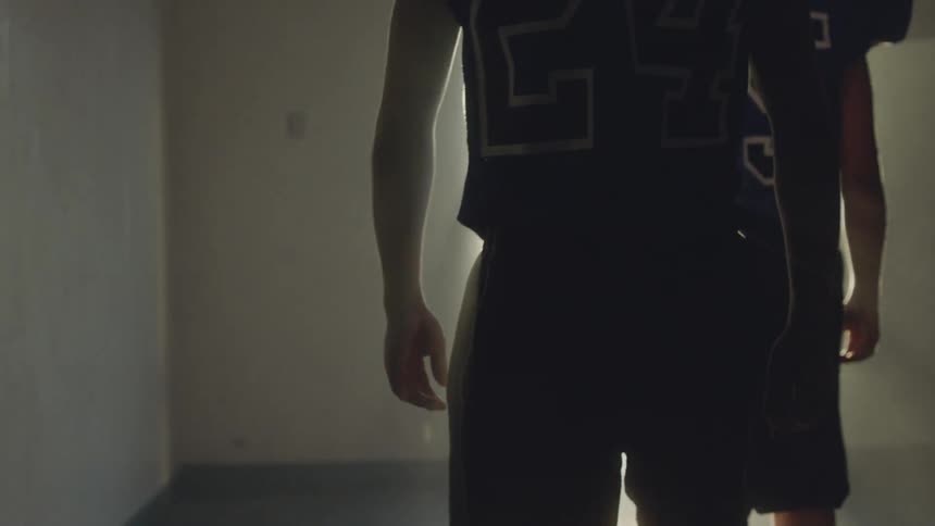 Football players in a tunnel