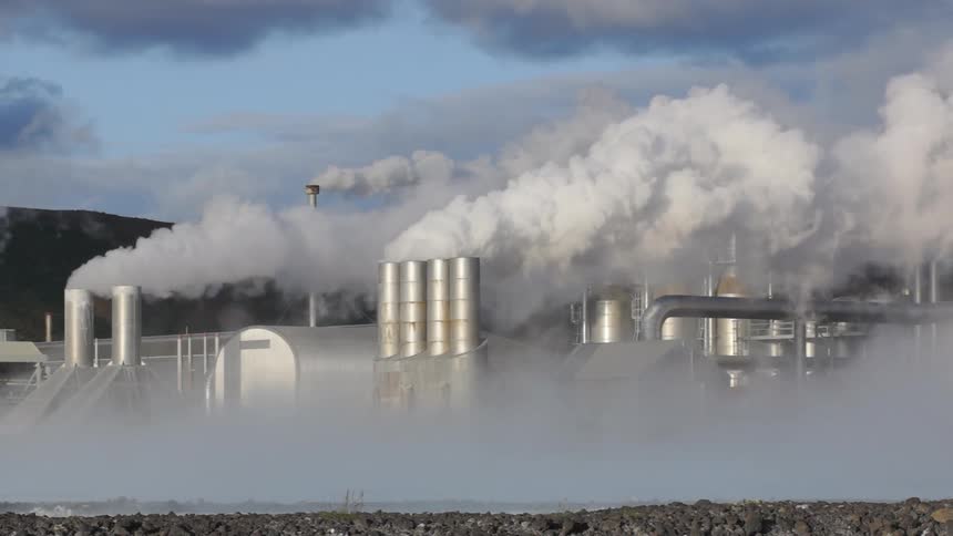 Smoke pours out of smokestacks