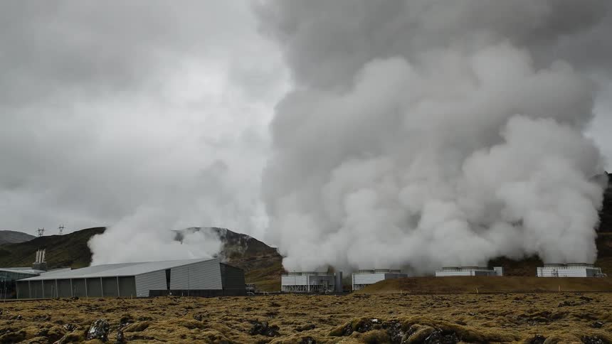 Smoke rising from industrial buildings in the country
