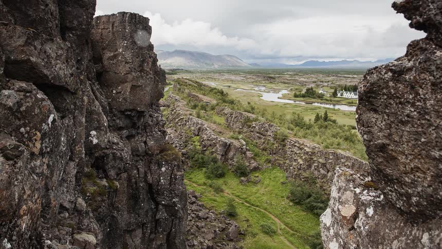 Tall rock formations tower above the valley