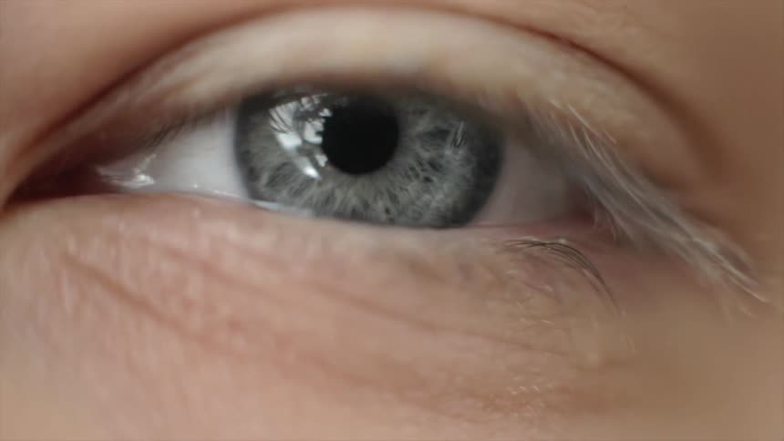 A person opens their eye