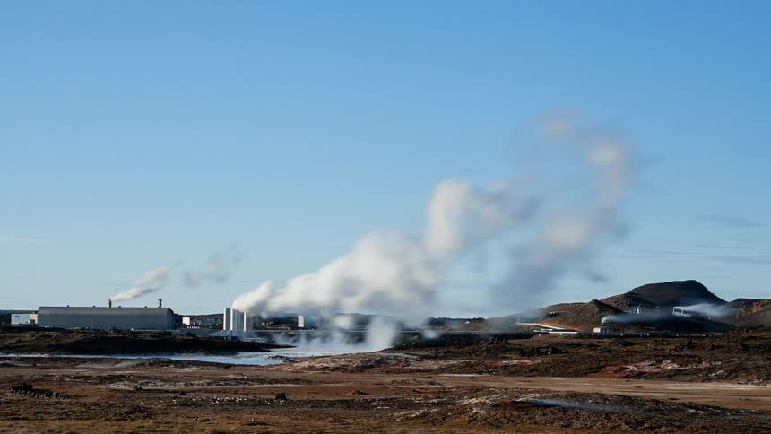 Smoke rises from a rural factory