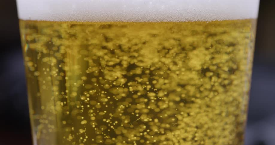 Bubbles in a drink rise to the top