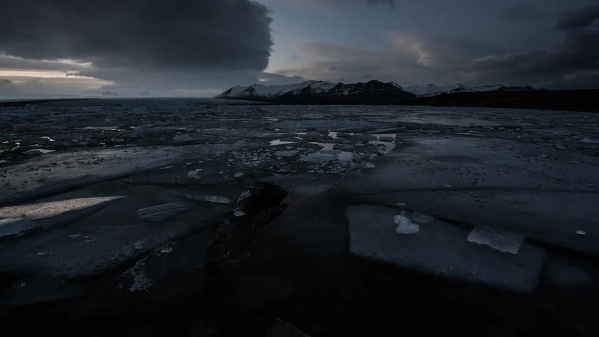Time lapse of a frozen sea with broken ice chunks