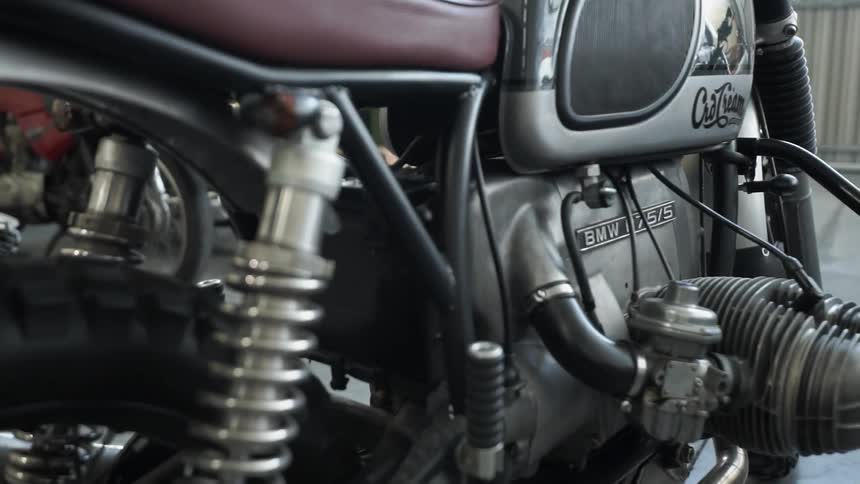 Motorcycles are parked in a garage