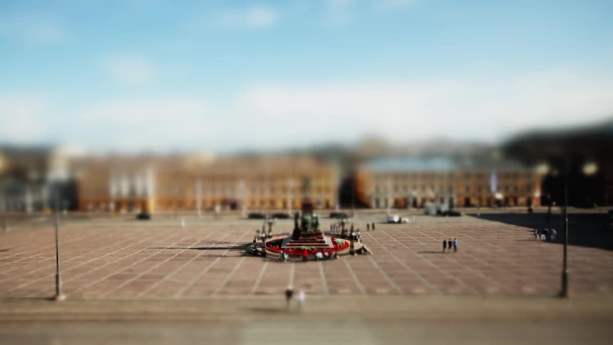 Pedestrians walk in a city courtyard