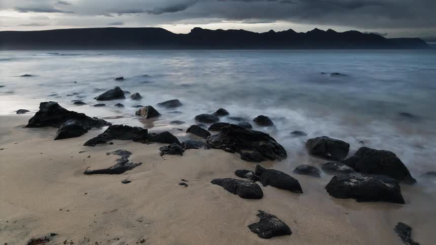 Water flows onto and recede from the shore