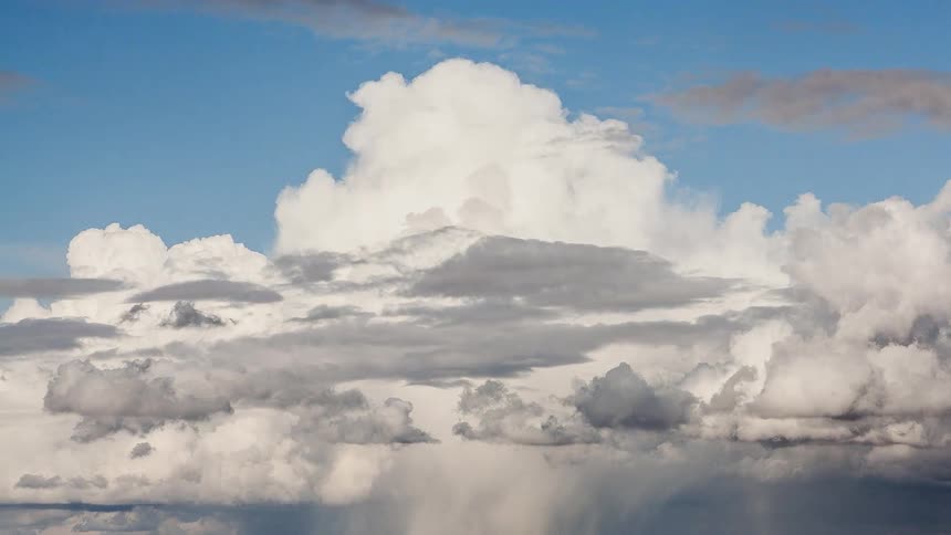 Gray and white clouds float in the sky
