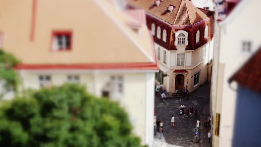 Pedestrians walk in a city