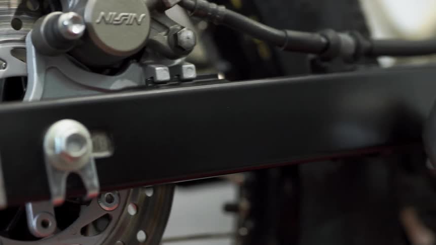A motorcycle sits in a garage