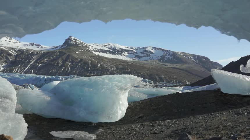 Ice melts in mountains on a clear day