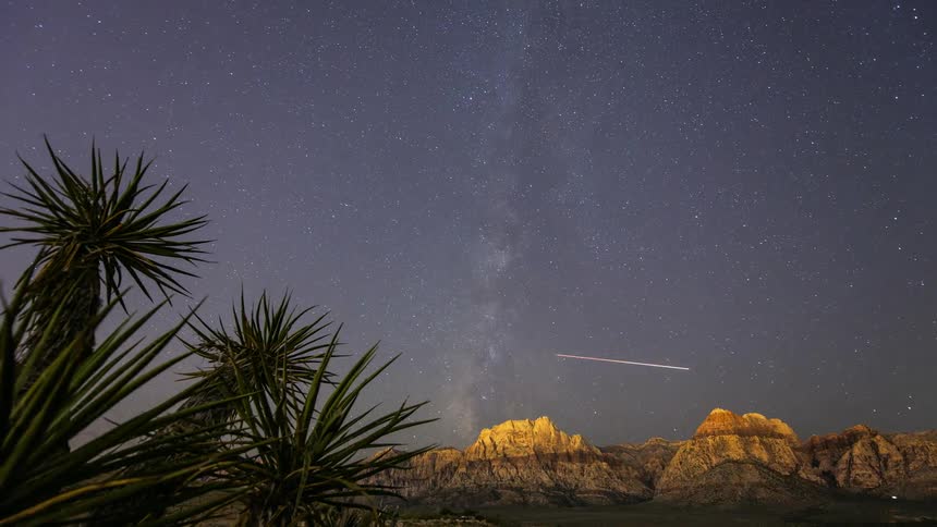 Stars shoot across the night sky