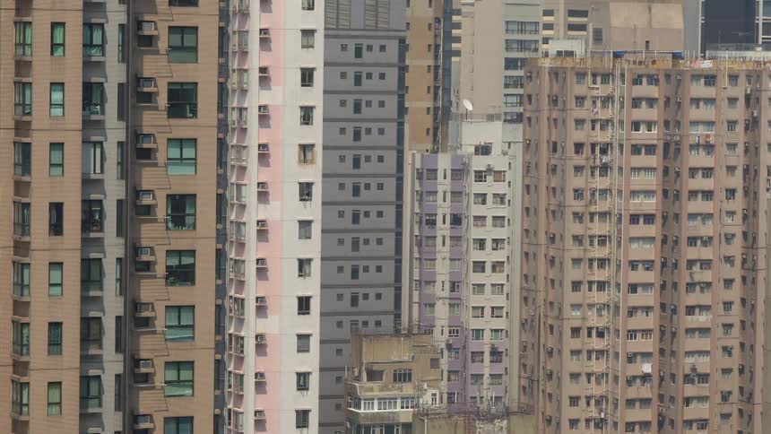Tall building standing in a large city