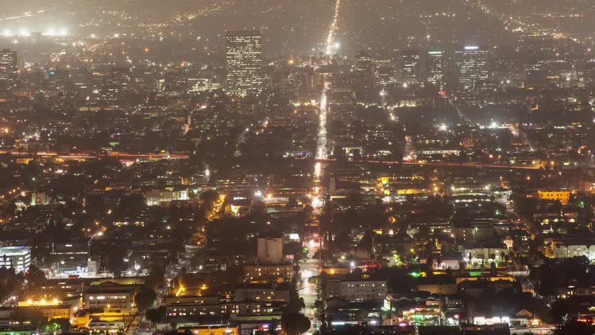 Traffic flows over city streets during the night