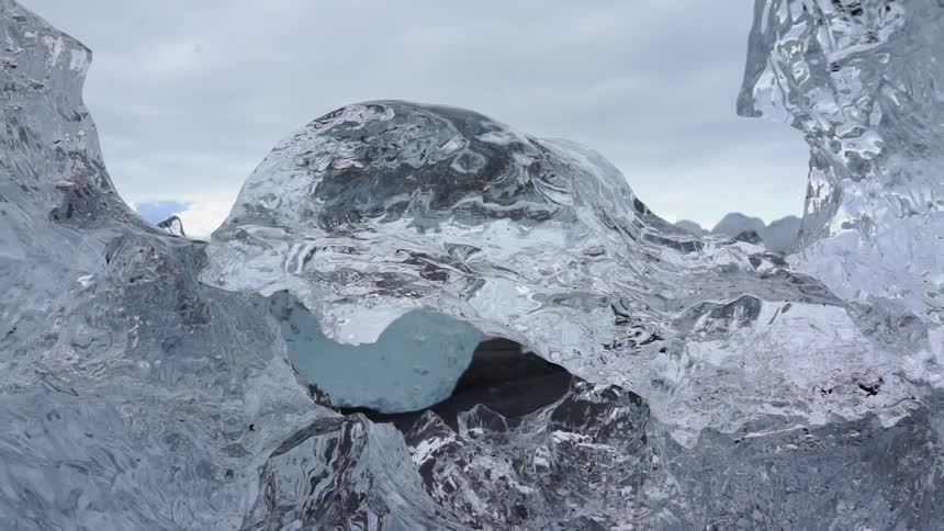 Blocks of ice is curved and ridged on a cloudy day