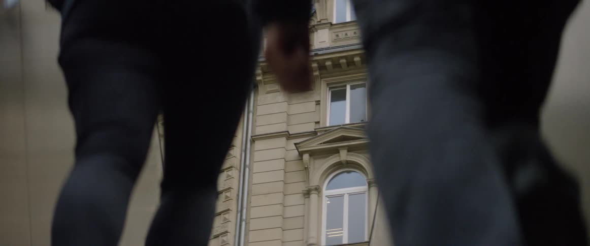 People are walking up a staircase outside in a city during the day
