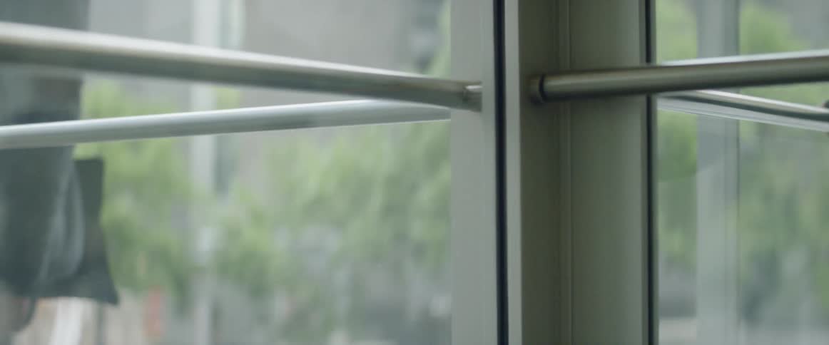 Revolving door spins as a person walks through it