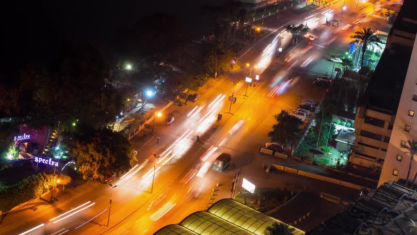 Traffic travels down the road at night