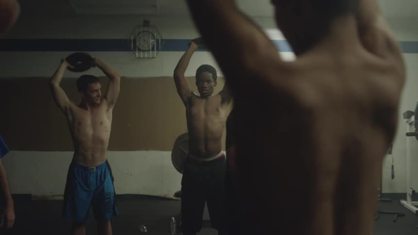 Gym with people lifting weights in a circle