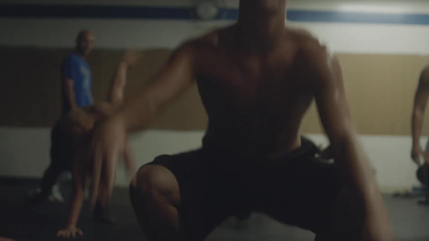 A group of young men do exercises