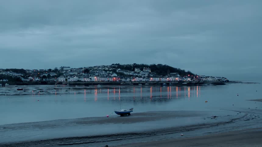 City lights reflect on a lake