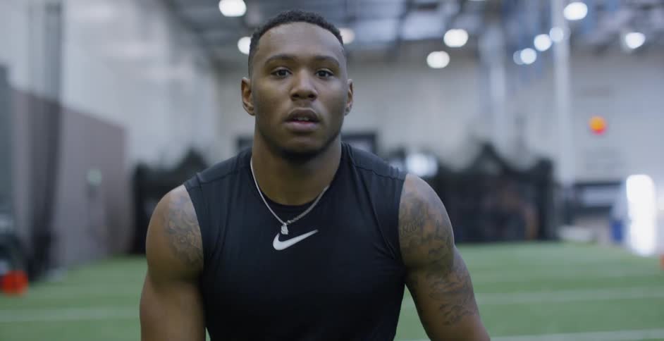 An athlete trains on an indoor field