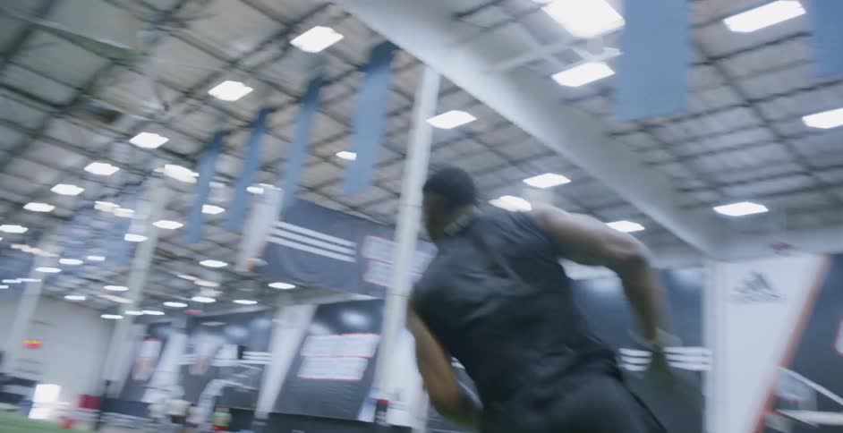 A football player trains indoors
