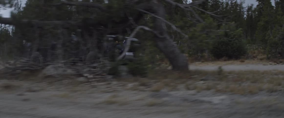 An suv drives on a bumpy dirt road