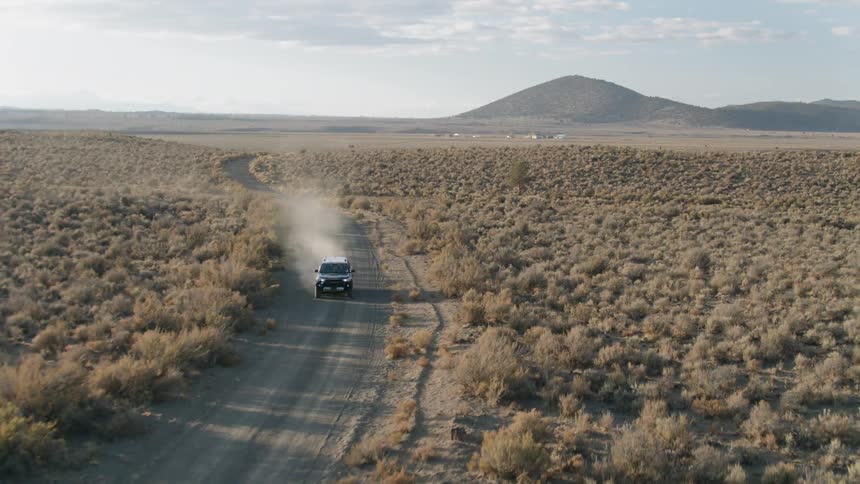 A truck is driven on a dirt road