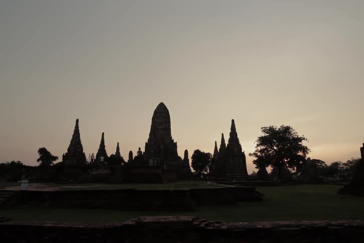 People walk around and view ruins and ancient statues