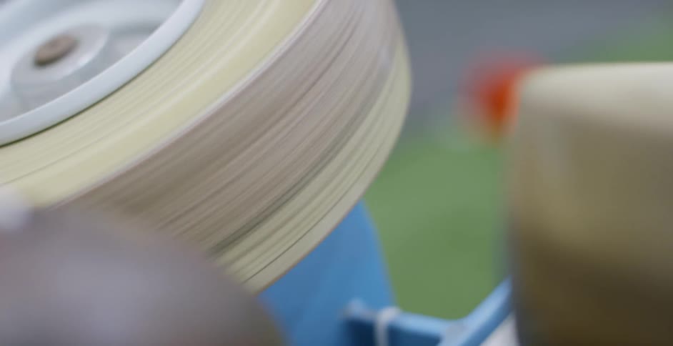 Object bounces off of two spinning wheels