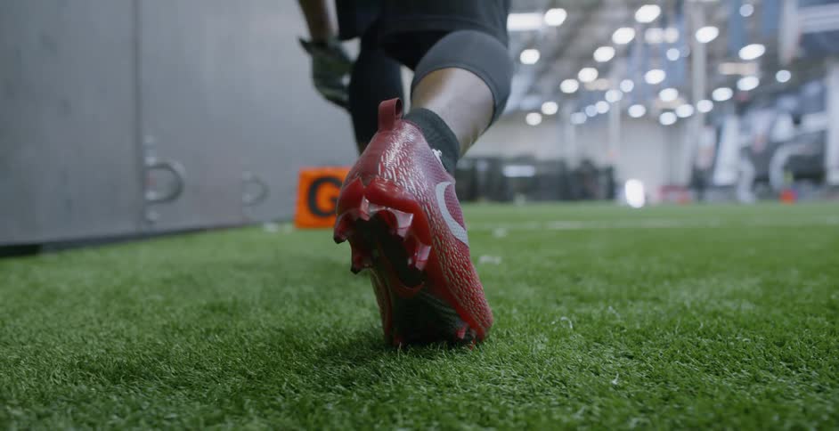 A football player trains indoors
