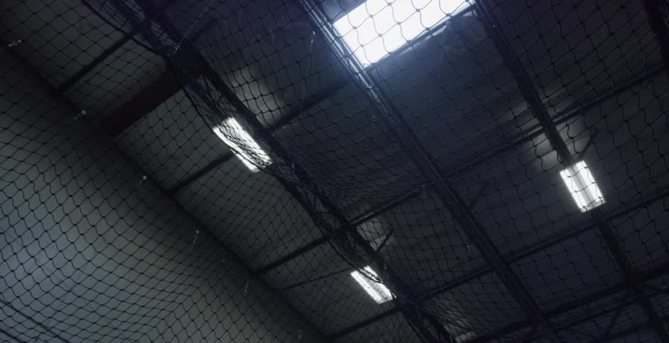 Netting hangs in an indoor athletic center