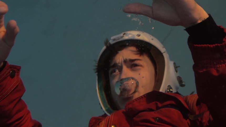 A man in a helmet underwater