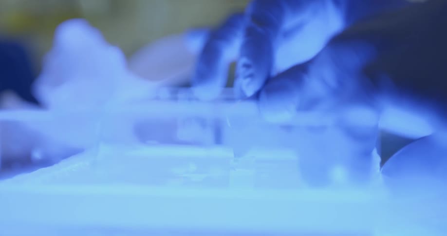 A scientist uses a razor in a lab