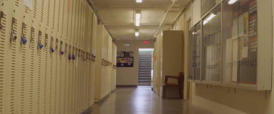 Lockers line the halls of a school during the day